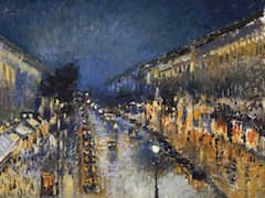 Boulevard Montmartre at Night by Camille Pissarro